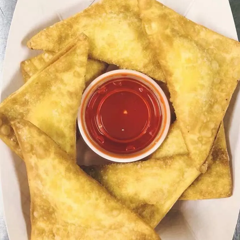 Crispy crab rangoons with sweet and sour sauce at Tate Cove Seafood, a Fast-Food Restaurant in Ville Platte