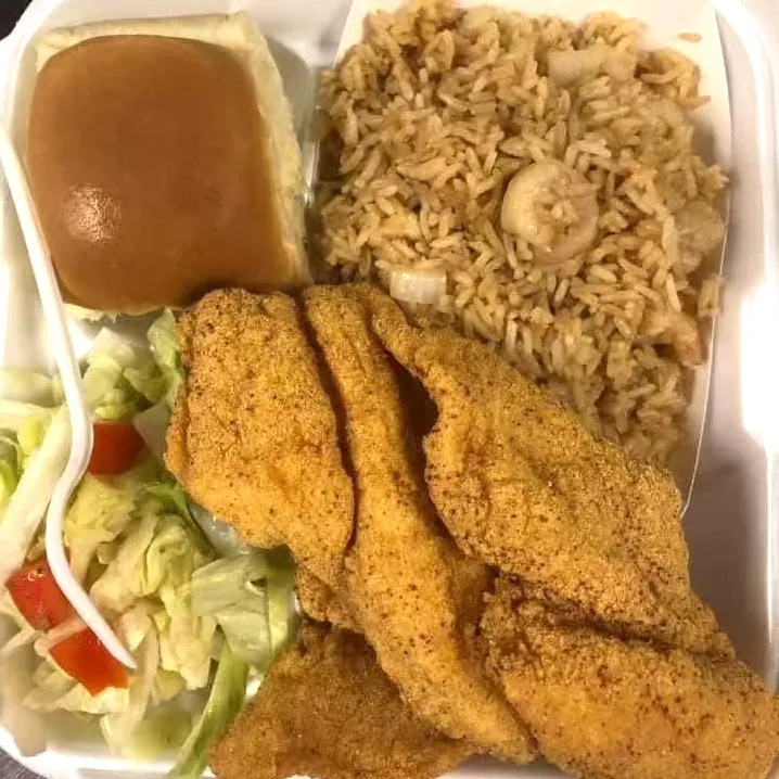 Fried catfish combo with fried rice and salad at Tate Cove Seafood, a Fast-Food Restaurant in Ville Platte